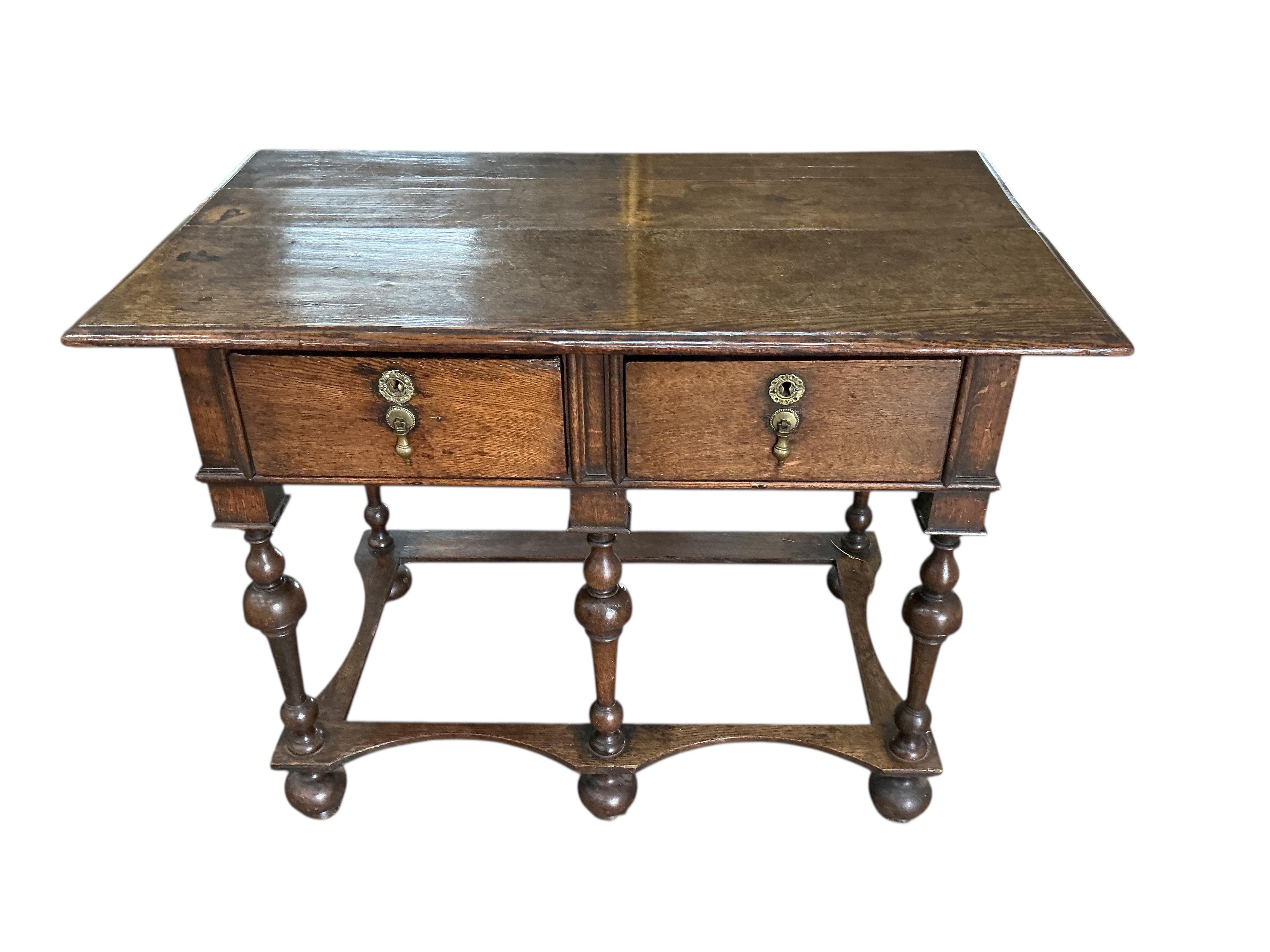 A William and Mary style oak two drawer side table, width 96cm, depth 54cm, height 72cm